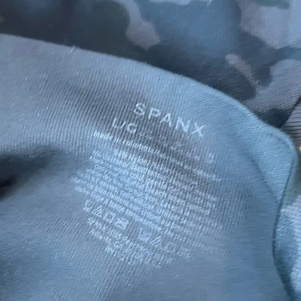 2 Spanx Black and Camouflage Leggings